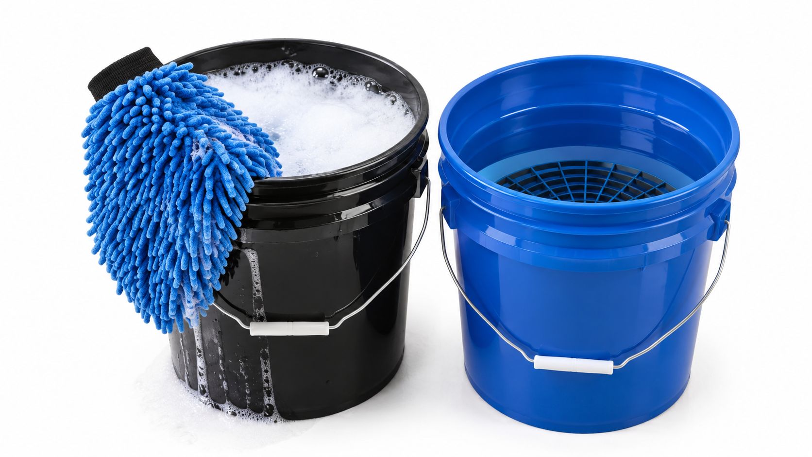 A black bucket filled with soapy water and a blue wash mitt beside a clean rinse bucket.